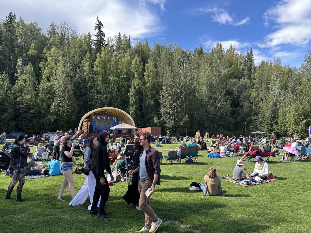 crowd of people in the Ester PArk during Ester Fest - stage in the background.